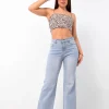 pantalon jean wide leg claris celeste claro elastizado vista de perfil mujer tiro alto rumaju jeans